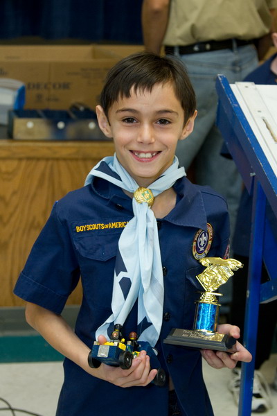 Nick holding his Pinewood Derby car